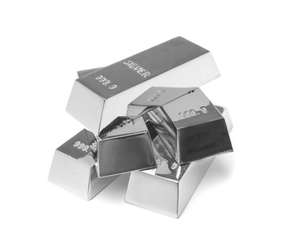 Stack of shining silver bars isolated on white