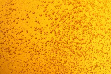Tasty beer with bubbles as background, closeup