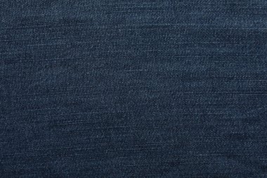 Arka plan olarak koyu mavi kotun dokusu, yakın plan