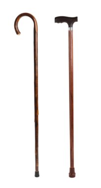 Elegant wooden walking canes on white background clipart