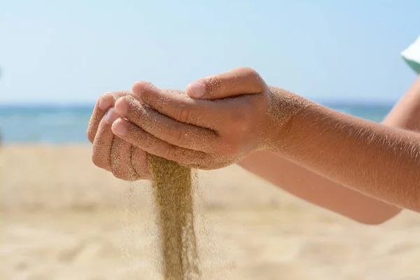 Child Pouring Sand Hands Beach Sea Closeup Fleeting Time Concept — Fotografia de Stock