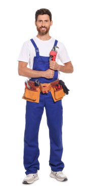 Professional plumber with pipe wrench and tool belt on white background