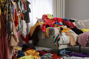 Mess of clothes all over room. Fast fashion clipart