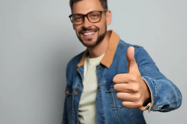 Man Showing Thumb Grey Background Focus Hand Space Text — Stock Photo, Image