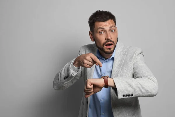 Emotional Man Checking Time Grey Background Space Text Being Late — Stock Photo, Image