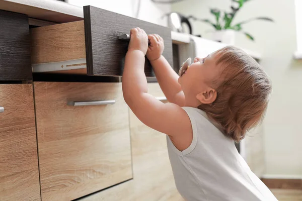 Little Child Exploring Drawer Indoors Dangerous Situation — 스톡 사진