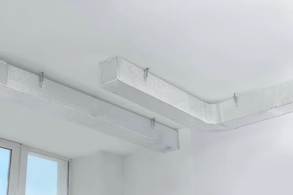 Ceiling with ventilation system indoors, low angle view