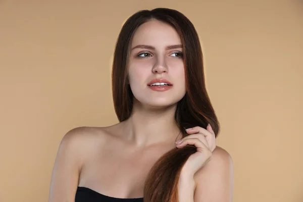 Young Woman Strong Healthy Hair Beige Background — Stockfoto