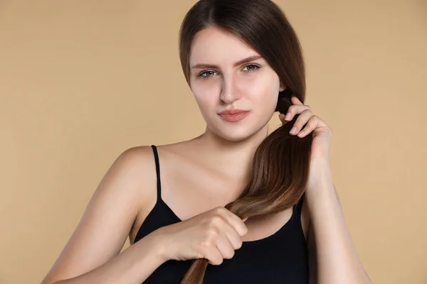 Young Woman Strong Healthy Hair Beige Background — Stockfoto
