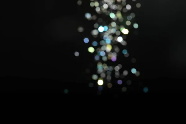 Wazig Zicht Kleurrijke Feestelijke Lichten Zwarte Achtergrond Bokeh Effect — Stockfoto