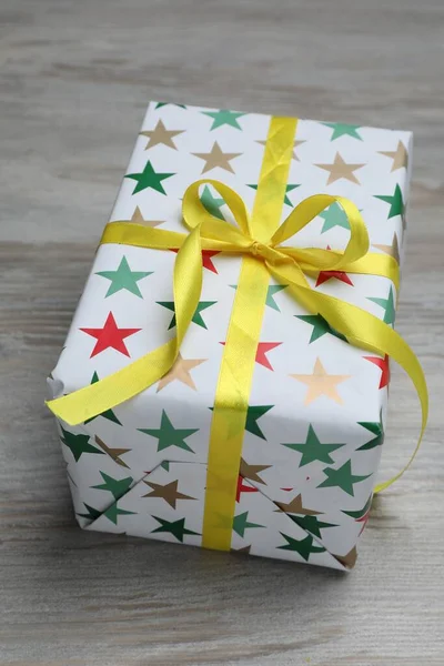 Beautifully Wrapped Gift Box Wooden Table Closeup — Zdjęcie stockowe