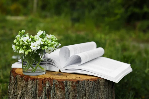 Open Book Glass Flowers Tree Stump Outdoors — Stock Fotó