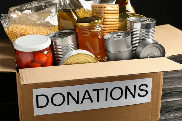 Donation Box Food Black Table Closeup — Fotografia de Stock