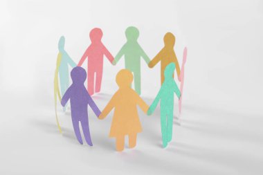 Paper human figures making circle on white background. Diversity and Inclusion concept