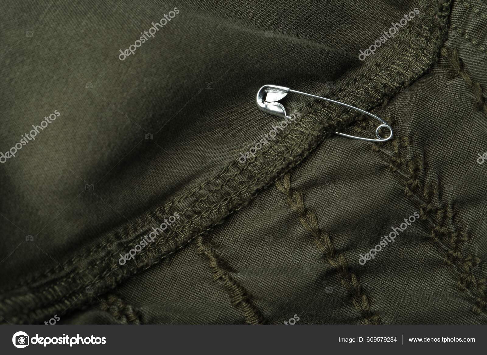 Top View Metal Safety Pin Clothing Stock Photo by ©NewAfrica 609579284