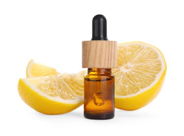 Bottle of citrus essential oil and cut fresh lemon isolated on white