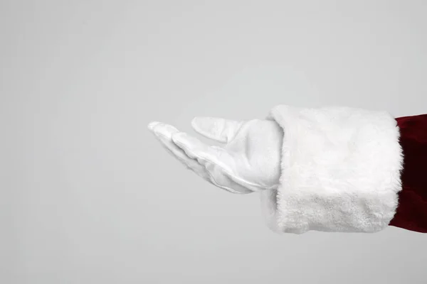 Santa Claus Holding Something Light Grey Background Closeup Hand — Stock Photo, Image