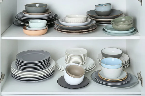 Different Clean Plates Bowls Shelves Cabinet — Stock Photo, Image