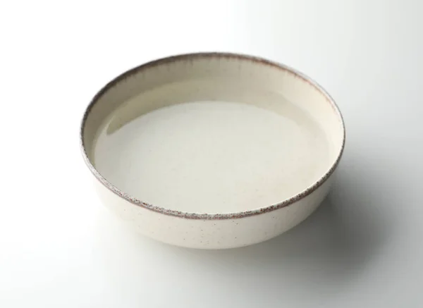 Beige Bowl Full Water White Background — Photo
