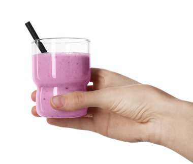 Woman with glass of delicious blackberry smoothie on white background, closeup