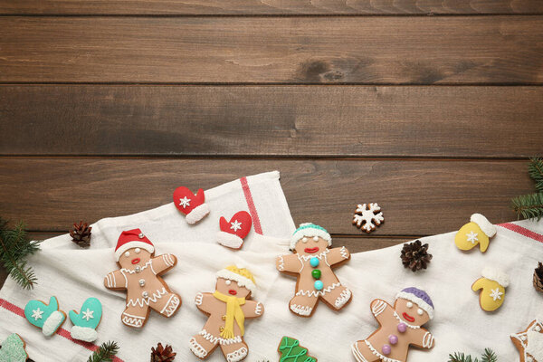 Delicious Christmas cookies on wooden table, flat lay. Space for text