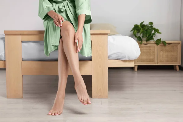 Woman Beautiful Smooth Legs Silk Robe Sitting Bed Home Closeup — 스톡 사진