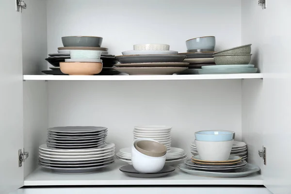 Different Clean Plates Bowls Shelves Cabinet — Stock Photo, Image