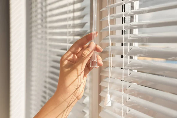 Woman Opening Horizontal Blinds Window Indoors Closeup — Photo