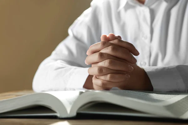 Woman Holding Hands Clasped While Praying Bible Wooden Table Closeup — Stock Photo, Image