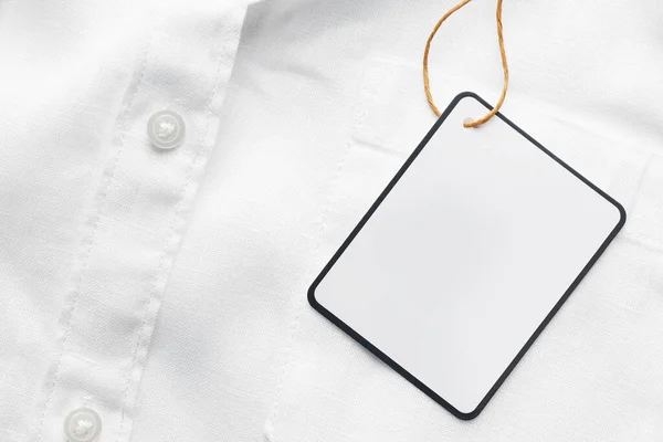 Cardboard Tag Space Text White Shirt Top View — Stockfoto