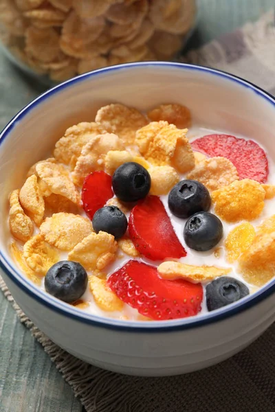 Delicious Crispy Cornflakes Milk Fresh Berries Light Blue Wooden Table — Stock Fotó
