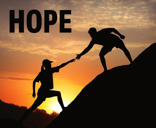 Concept Hope Man Helping Woman Climb Hill Sunset — Stock Photo, Image