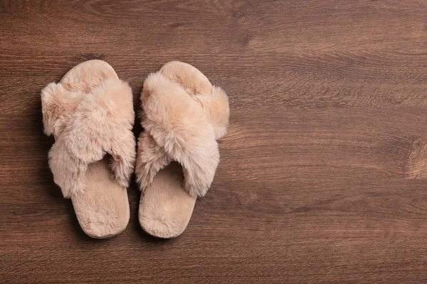 Pair Soft Slippers Wooden Floor Top View Space Text — Stock Photo, Image