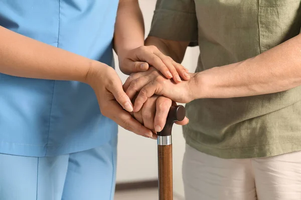 Elderly Woman Walking Cane Female Caregiver Indoors Closeup — Foto de Stock