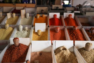 Assortment of different aromatic spices in containers