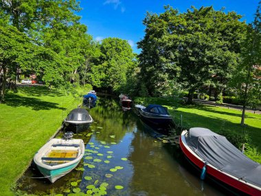 Beautiful view of canal with moored boats on sunny day