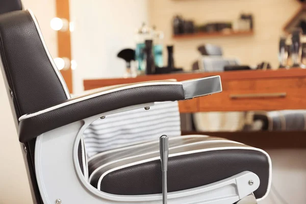 Closeup view of professional barber chair in hairdressing salon