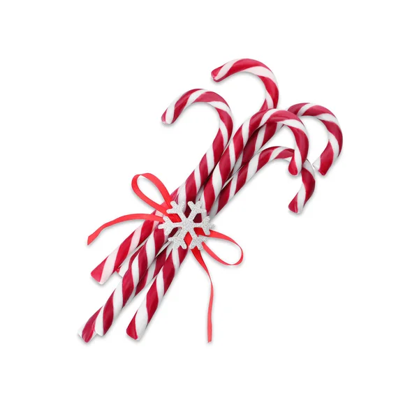 白色背景的红色蝴蝶结雪片的甜圣诞糖果手杖 — 图库照片