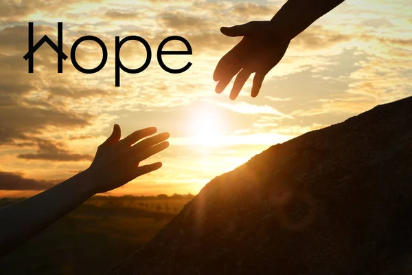 Concept Hope Man Helping Woman Climb Hill Sunset Closeup — Stock Photo, Image