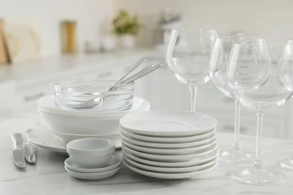 Different Clean Dishware Cutlery Glasses White Marble Table Kitchen — 스톡 사진