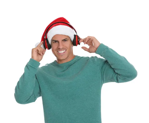 白い背景のヘッドフォンを持つ幸せな男 クリスマス音楽 — ストック写真