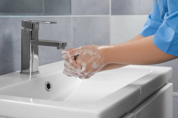 Doctor Washing Hands Water Tap Bathroom Closeup — стоковое фото