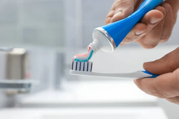 Man Applying Toothpaste Brush Bathroom Closeup Space Text — Stock Photo, Image