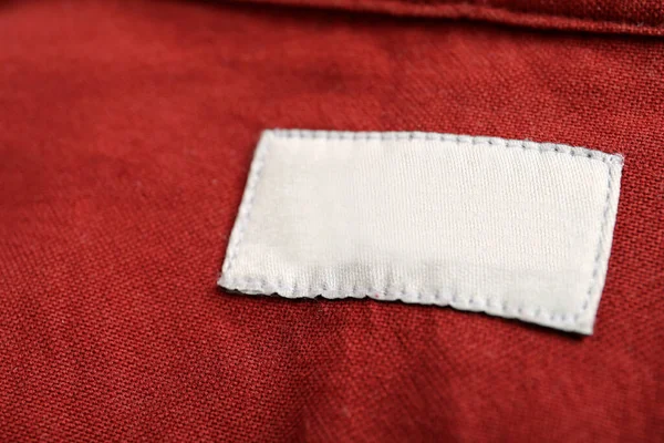 Blank Clothing Label Red Shirt Closeup — Foto Stock