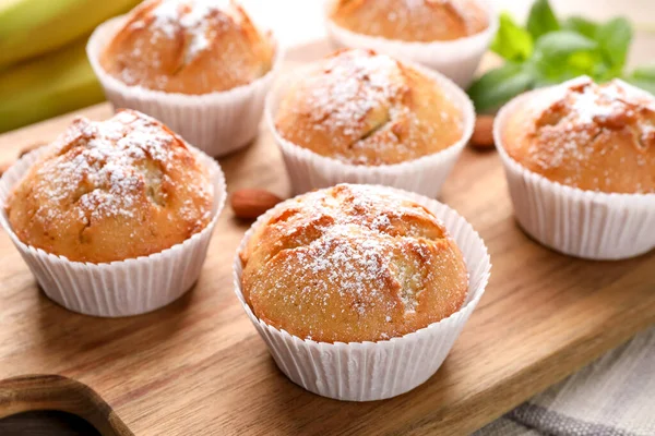 Tasty Muffins Powdered Sugar Wooden Board Closeup — Fotografia de Stock