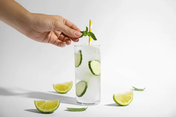 Woman Putting Mint Glass Tasty Fresh Cucumber Water Sliced Lime — Stock Photo, Image