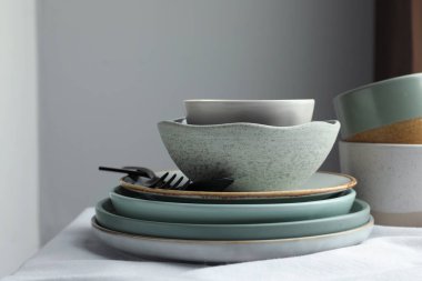 Stylish empty dishware and cutlery on table indoors