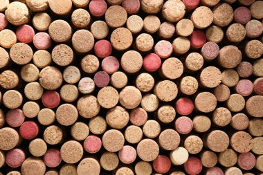 Many wine bottle corks as background, top view