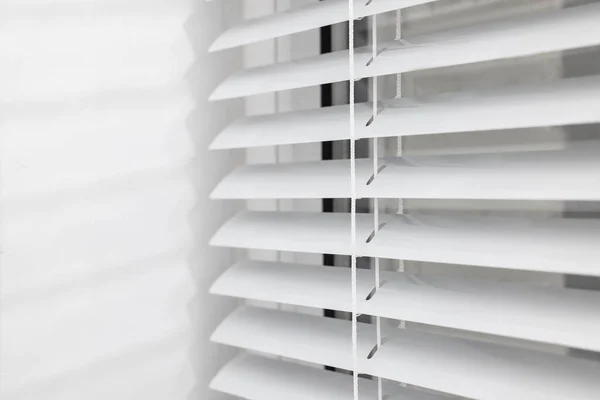 Stylish window with horizontal blinds, closeup view