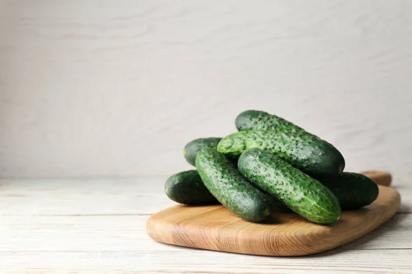 Board Fresh Ripe Cucumbers White Wooden Table Space Text — Stock Photo, Image